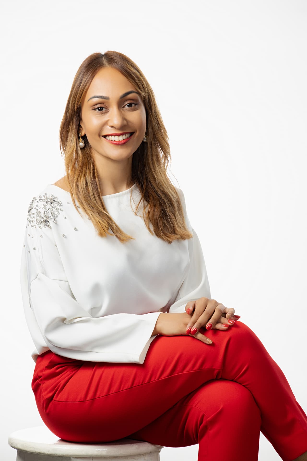 Kaushali Kusumapala seated in a studio portrait